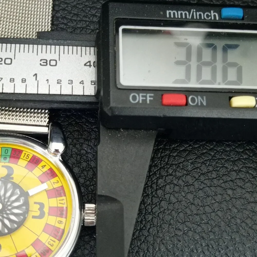 Vintage 1971 Roulette Manual Mens Silver Watch W/Steel Strap & Yellow accents